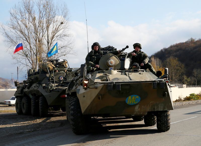 FILE PHOTO: Russian peacekeepers drive near Arutyunagomer, in the region of Nagorno-Karabakh